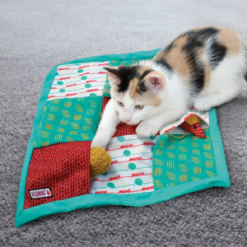 Puzzlements Pockets Play Mat by Kong promo - cat playing with a play mat