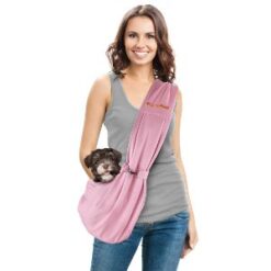 Young woman wearing green shirt and a pink sling for small dogs